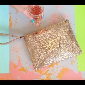 Kelly Wynne clutch / purse in rose gold (gently used)